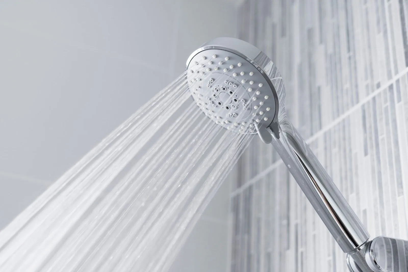 Image of a shower head designed to address low water pressure, featuring multiple shower heads for enhanced water flow.